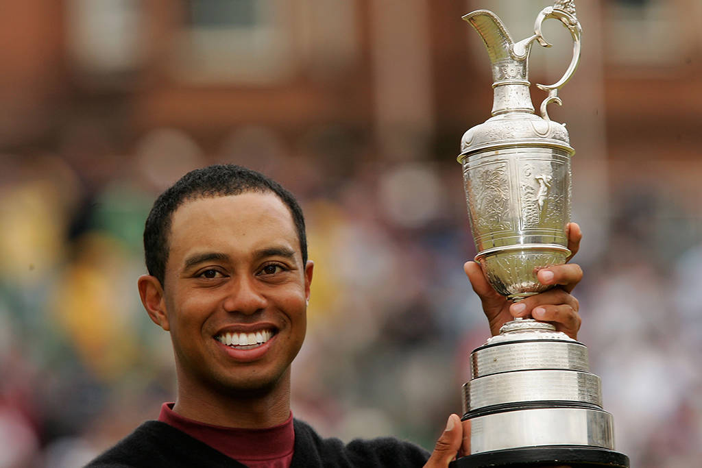 Tiger Woods with the Claret Jug after winning The Open for a second time in 2005
